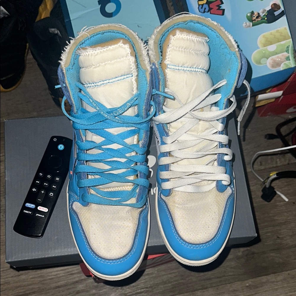 Blue and White High-Top Sneakers
Jordan 1 off white unc
